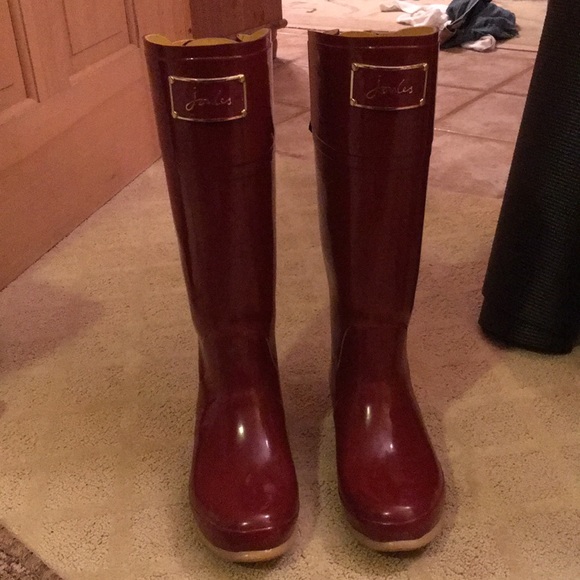 red rain boots with bow on back